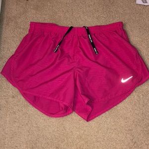 Pink Nike running shorts
